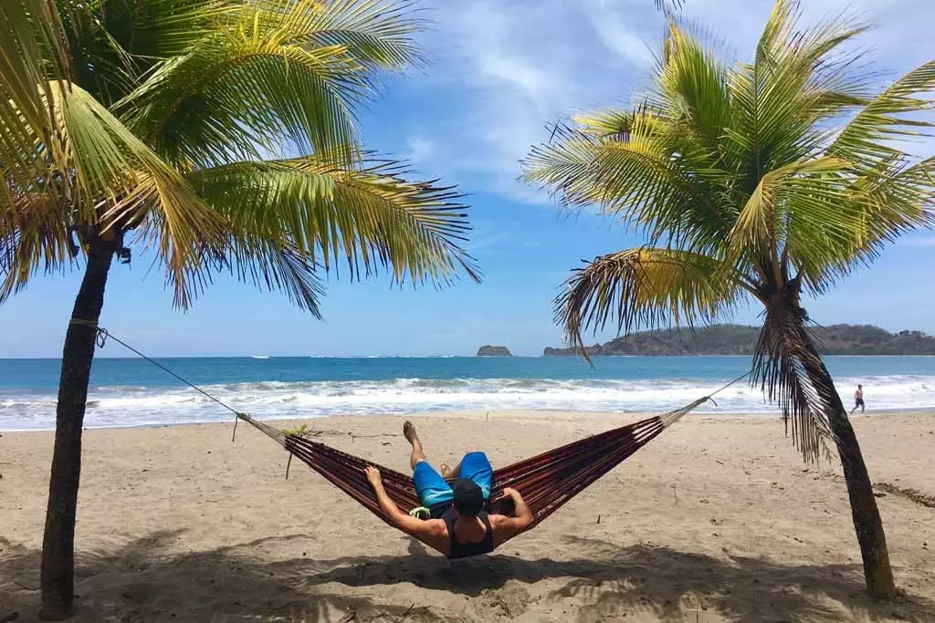 Man sitting in a Hammoch at Carrillo Beach in Costa Rica